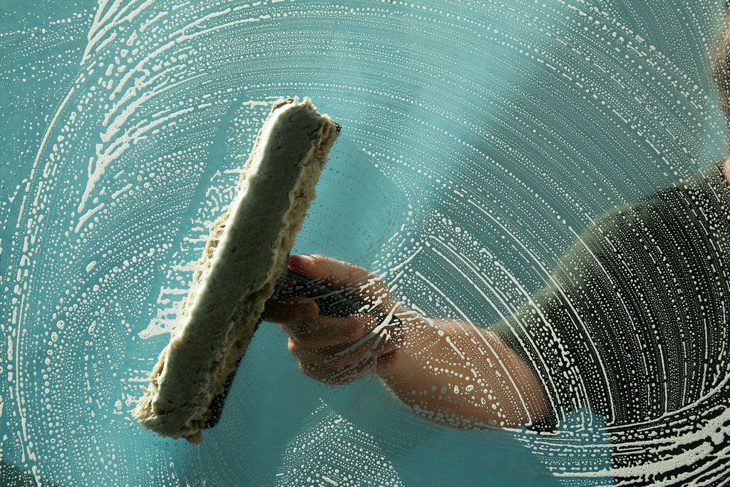 A squeegee drawn across a soaped window